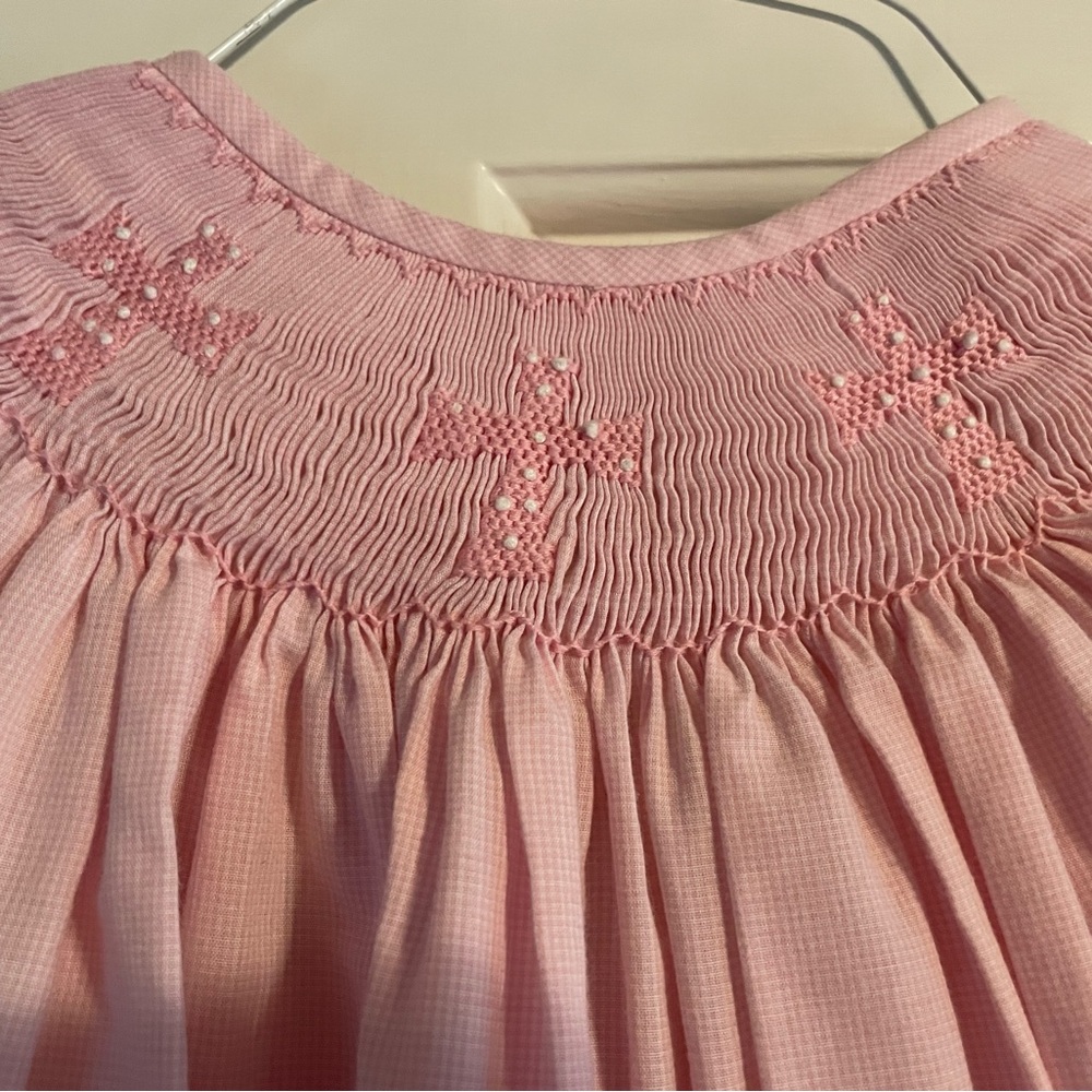 Pink smocked cross dress.